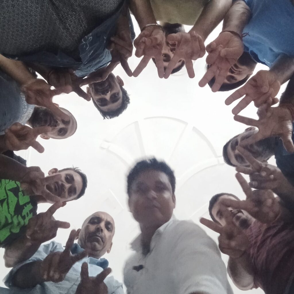 A group of people in a circle or a group huddle